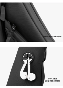 Close-up of waterproof fabric and headphone port on a black functional chest bag