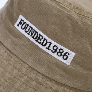 Washed vintage bucket hat in khaki with FOUNDED1986 embroidery and reinforced stitching