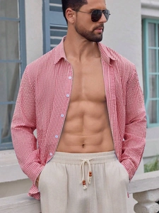 Outdoor shot of men's red and white striped long sleeve shirt with seersucker texture