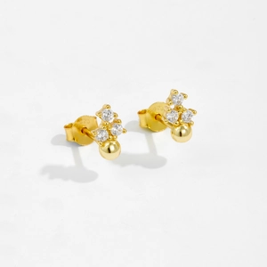 Macro shot of 18K gold-plated S925 sterling silver stud earrings with zircon and S925 hallmark