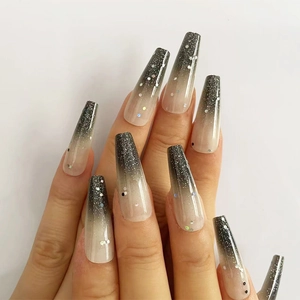 Detail of long coffin nails with black and white gradient and glitter sequins