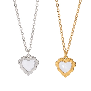 French vintage heart shell necklaces in gold and silver finishes with embossed details