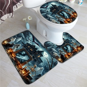 Three-piece Halloween bathroom mat set with spooky castle, ghost, and pumpkin print