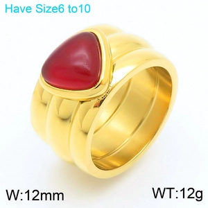 Detailed view of irregular 12mm wide gold ring featuring a triangle red turquoise inlay