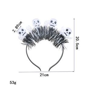 Detail showing dimensions of Halloween headband with white skulls and black tinsel