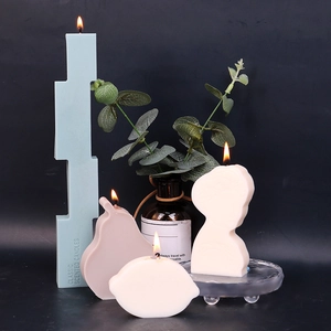 Artistic geometric soy candle set with tall blue tower and white portrait silhouette