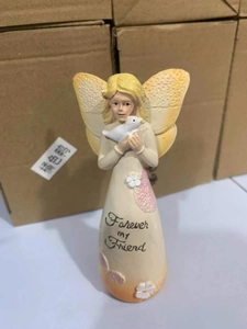 Detail of angel resin figurine with dove and Forever my Friend script engraving