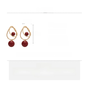 Detailed product specs of gold geometric earrings with burgundy beads and copper material