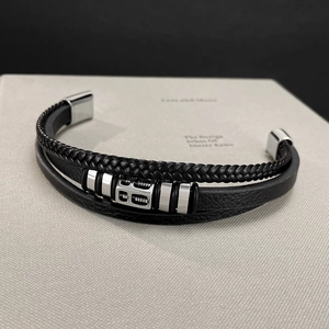 Close-up of multilayer black leather bracelet with silver stainless steel slider bead