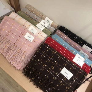 Classic series multi-color plaid tassel scarves in knit fabric stacked on wood background