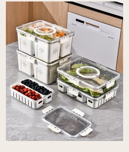 Detailed view of stackable PET food storage boxes with white lids and drainage inserts