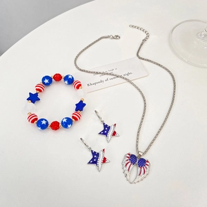 Detailed set of US flag theme jewelry with rhinestone wing heart necklace and star earrings