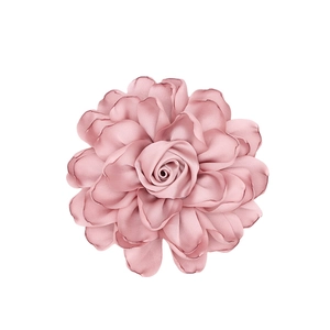 Close-up of pink satin rose fabric flower showing multi-layered petals and silk texture