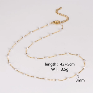 Detail showing 3mm pearls and 42+5cm chain length on a gold station necklace