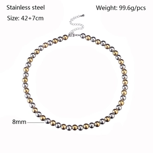 Detail of 8mm silver and gold beaded stainless steel necklace with adjustable lobster clasp