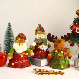 Christmas tree shaped plush gift bags featuring Santa, snowman and reindeer designs