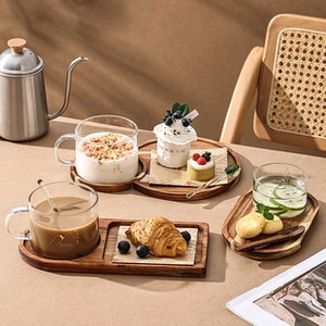 Japanese style wooden serving tray set with glassware and snacks for cozy tea time