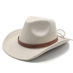 Detail of faux suede western hat featuring a brown leather band with geometric engraving