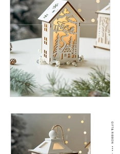 Detail of laser-cut wooden Christmas cabin featuring warm LED lights and reindeer patterns
