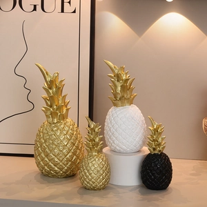 Modern pineapple resin sculptures in gold, white and black for stylish home tabletop decor