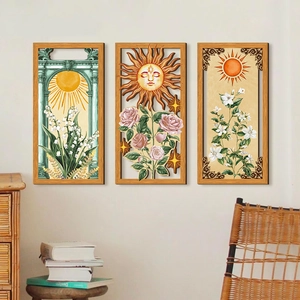 Bohemian triptych wall art featuring sun and floral motifs in warm wooden frames