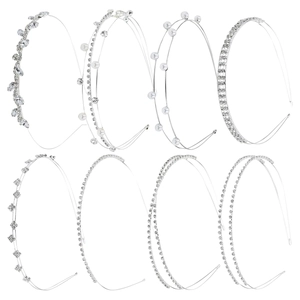 Close-up of 8-piece bridal headband set with pearls and rhinestones on white background