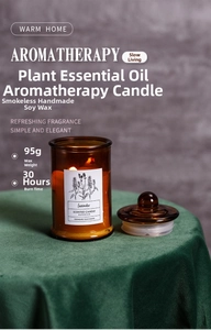 Scented lavender soy candle in amber glass jar with 30-hour burn time on green velvet