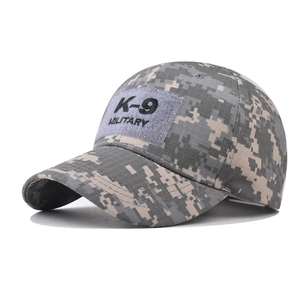 Detailed view of K-9 military embroidery on a digital camouflage baseball cap