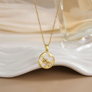 Golden bird pendant necklace with zircon floral pattern and artistic round design