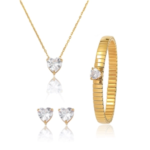 Detailed view of a gold heart jewelry set including necklace, earrings and bracelet