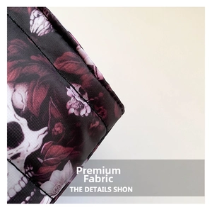 Macro shot of durable fabric with gothic skull and red rose print detailing
