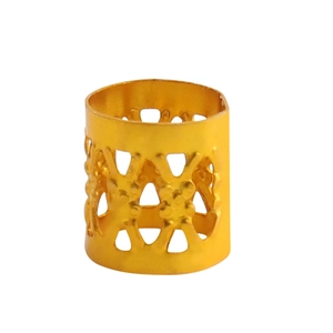 Detail of golden hollow metal hair bead with geometric patterns for DIY braiding