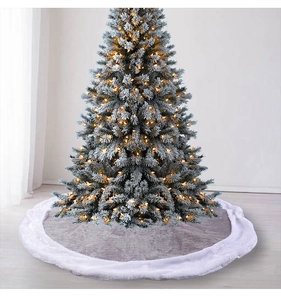 Detail of grey plush Christmas tree skirt showing soft faux fur texture and decor