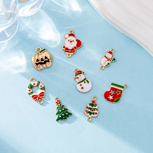 Set of 10 festive Christmas enamel alloy charms including Santa, snowman and tree icons