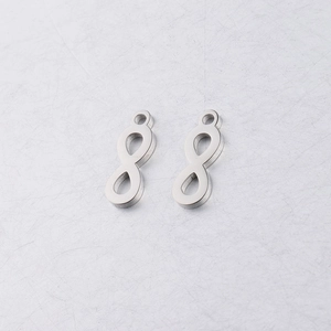 Close-up of infinity symbol charms in polished stainless steel for DIY jewelry making