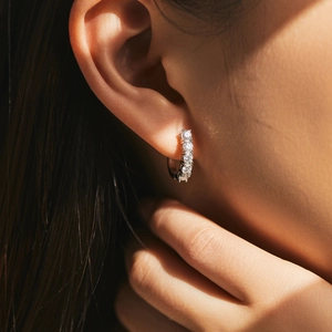Elegant s925 silver U-shape hoop earrings featuring a row of sparkling D-color moissanite stones
