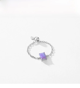 Detail view of S925 sterling silver chain ring with purple rectangular opal and heart charm