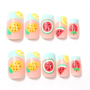 Detail of square artificial nails with hand-painted summer fruit patterns and blue tips