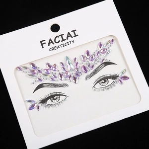 Sparkling purple acrylic face gems and forehead rhinestones for festival makeup looks