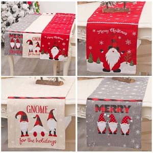 Christmas burlap table runner set with gnome and snowflake patterns in red, grey, and beige
