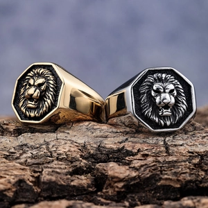 Mens vintage stainless steel lion head rings with gold and silver finish on wood