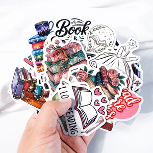 Macro detail of holographic book stickers with glitter effect and floral reading designs