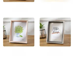Detail of minimalist 6x8 wooden picture frames in beige, gold, pink, and grey finishes