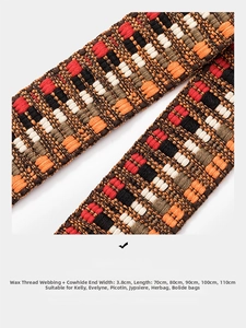 Macro detail of 3.8cm wide woven checkered bag strap with genuine leather ends