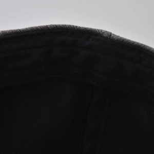 Close-up of internal sweatband stitching and high-quality fabric on cotton beret cap