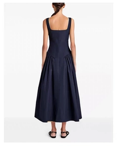Detailed back view of dark blue sleeveless maxi dress with low waist and pleated skirt