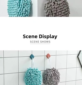 Detail of soft absorbent chenille hand towels with wall-mounted hanging hooks