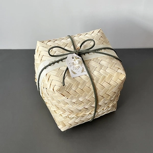 Detail of square bamboo gift box with velvet rope, love ribbon and pearl accent