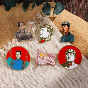 Set of 6 classic Chairman Mao enamel pins and China flag badges on fabric background
