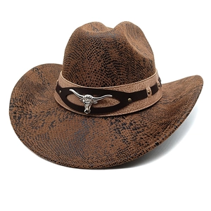 Detailed view of western cowboy hat featuring brown snakeskin texture and metal bull head